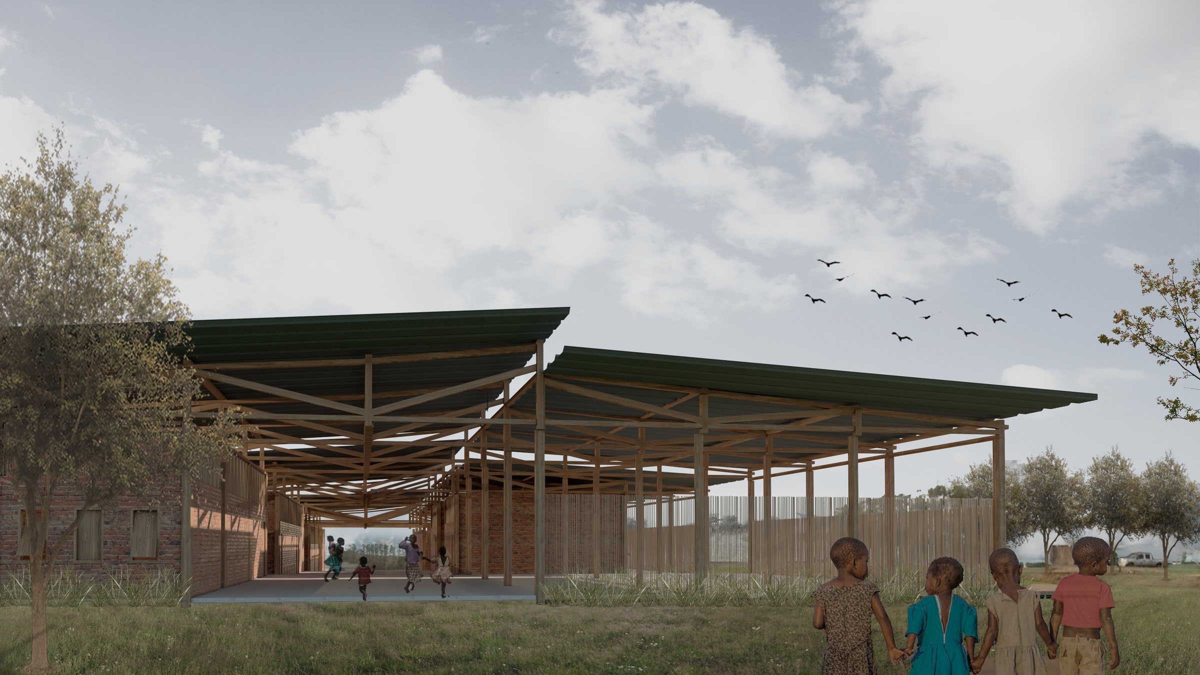 The open veranda under the timber roof structure, with the classroom block on one side and the field on the other.