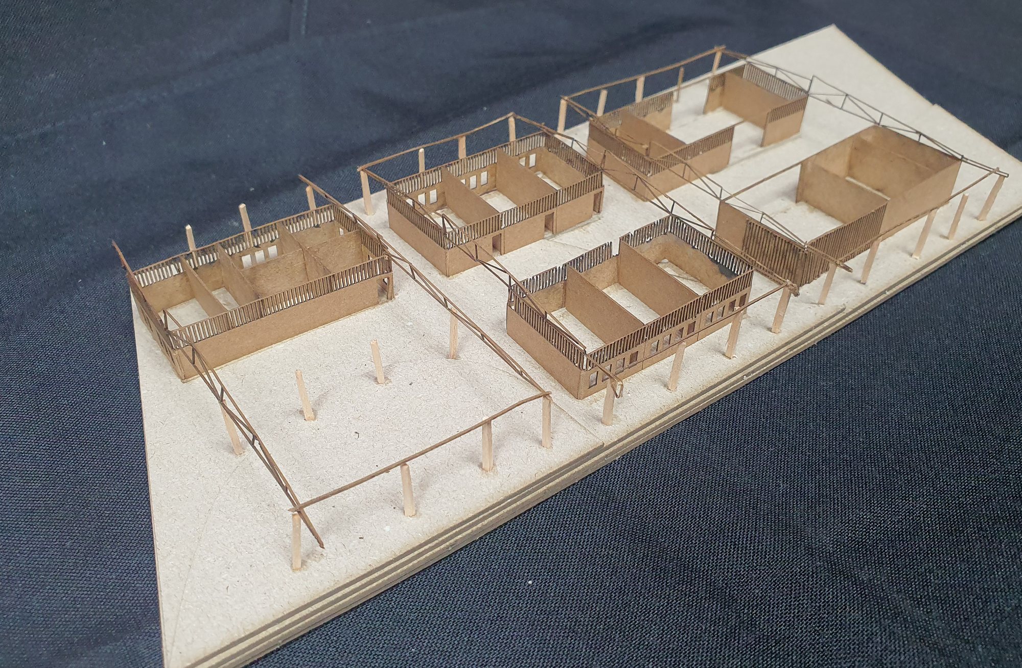 The physical study model seen from above: the three platforms and the courtyards between the blocks.
