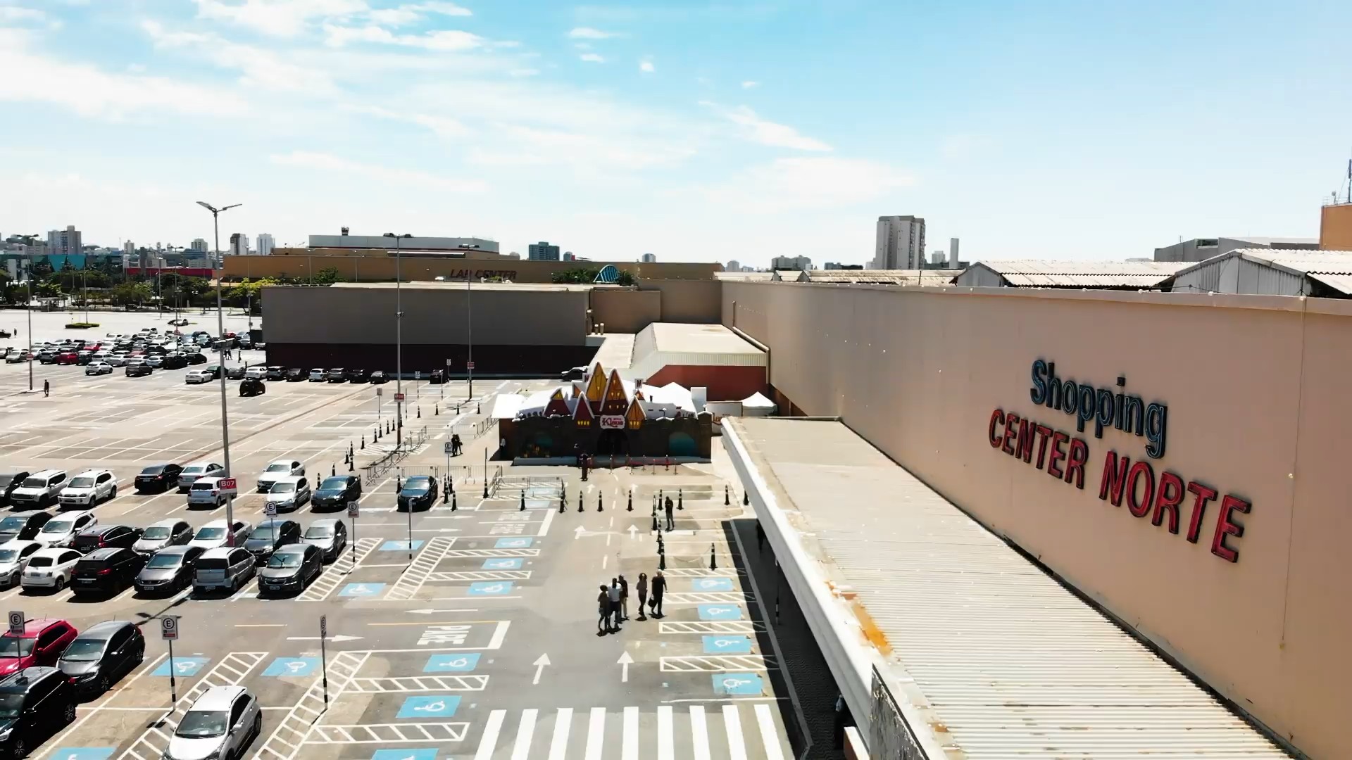 Drone view of Shopping Center Norte with the Casa Klaus in its car park