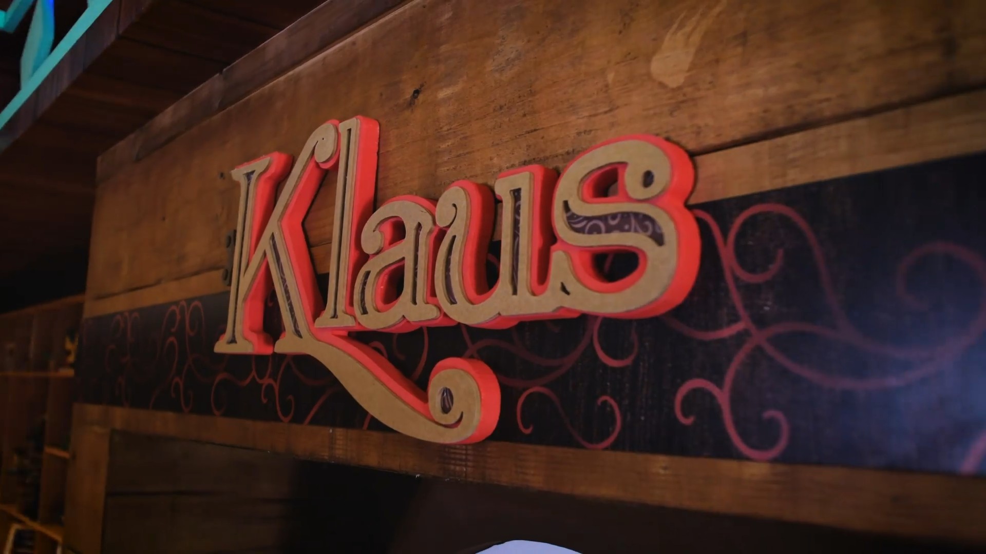 Carved Klaus sign on the workshop's timber wall