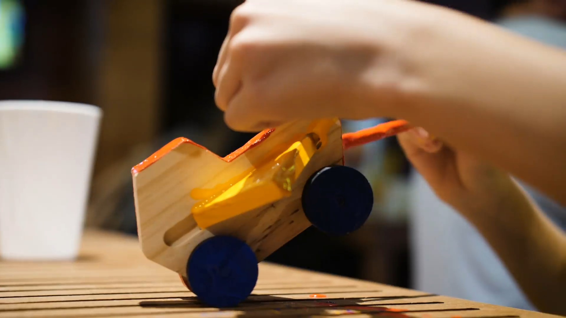 A finished wooden toy car