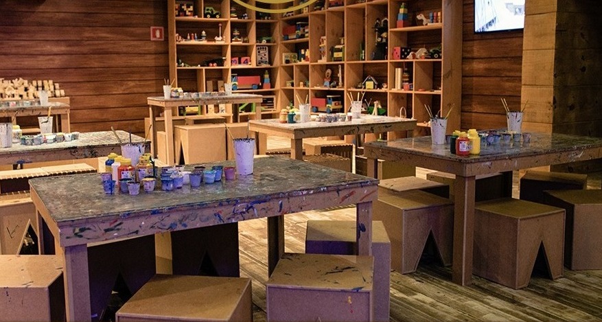Klaus's workshop: timber walls, toy shelves and workbenches