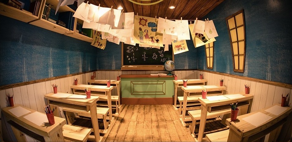 Alva's school: desks, blackboard and drawings on a line