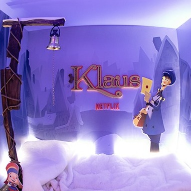 Snowy Klaus wall lit in violet