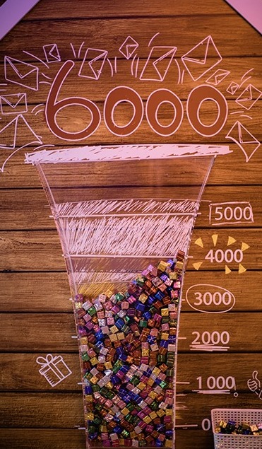 Donation counter filled with toys towards the 6,000 goal