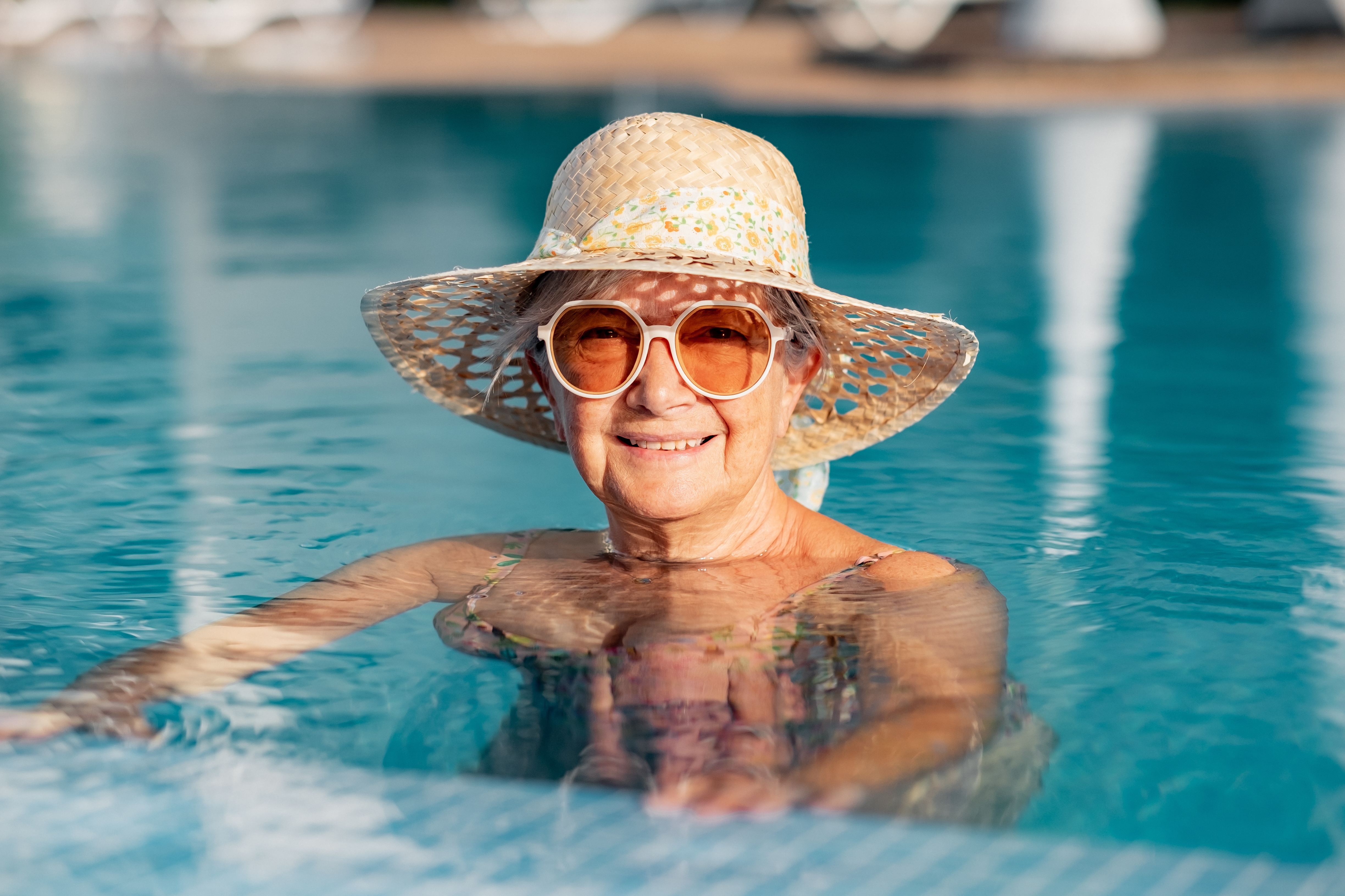Woman in swimming pool stock image