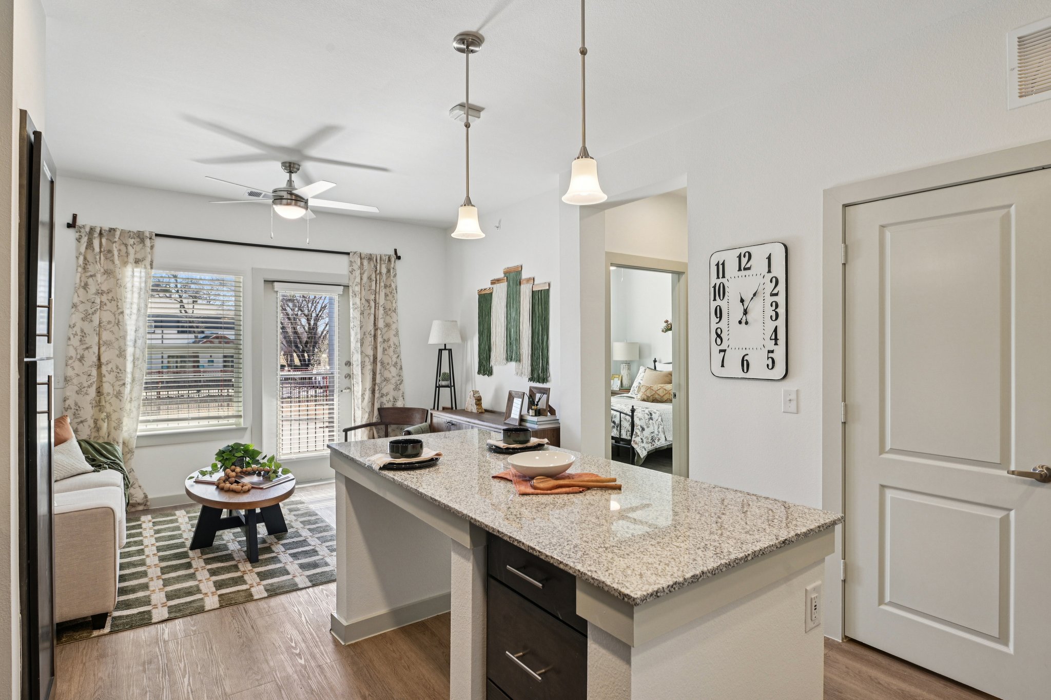 Kitchen with island and view of living and bed rooms
