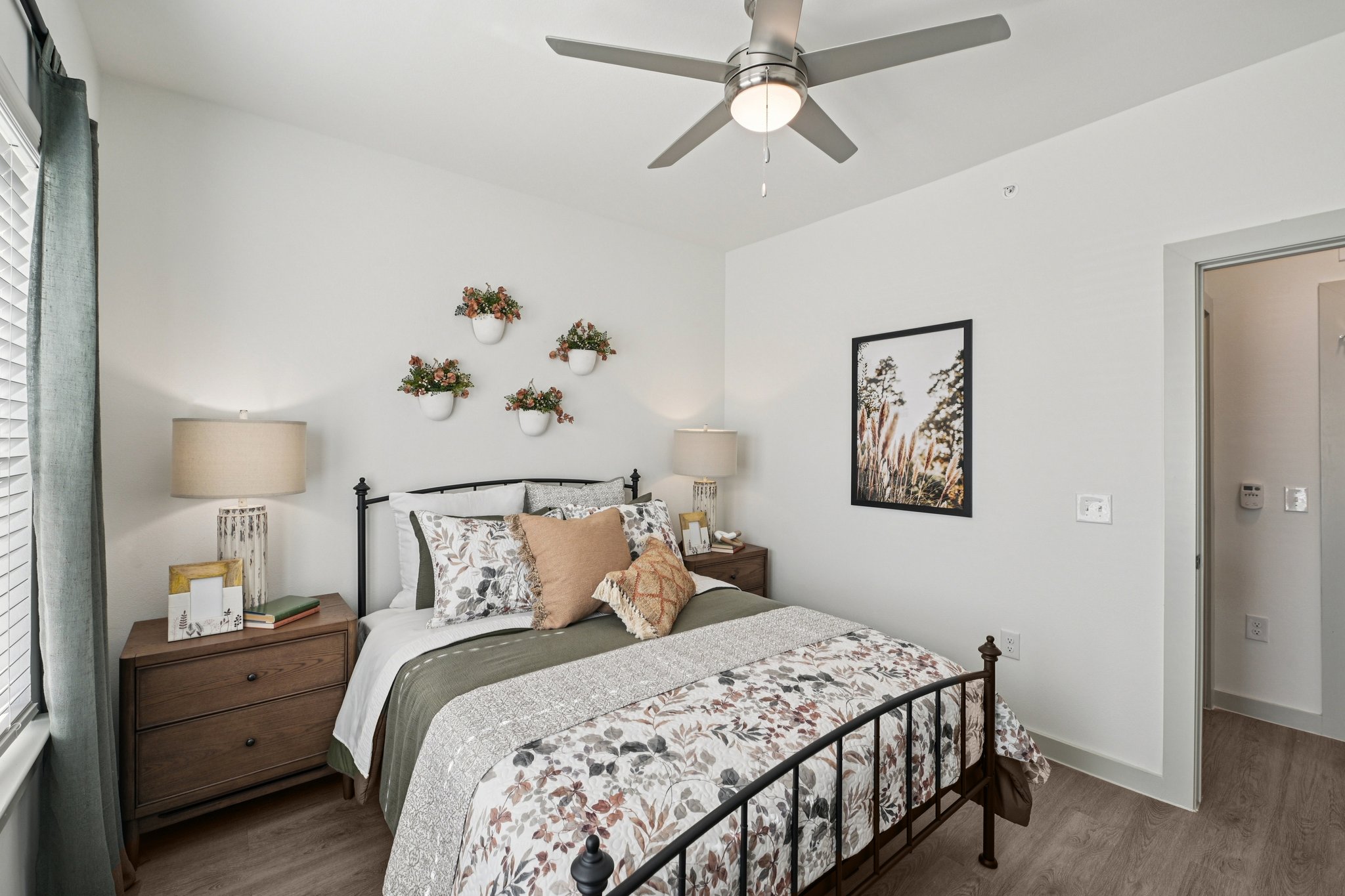 Bedroom with bed, ceiling fan and lamp