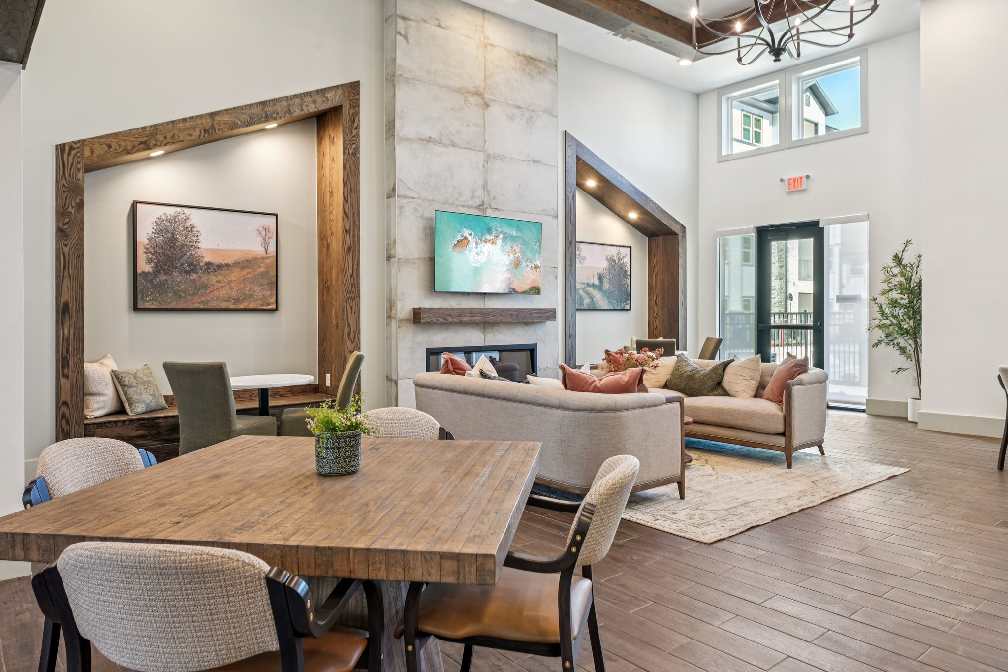 Clubhouse with dining tab, and sofa area with tv and fireplace