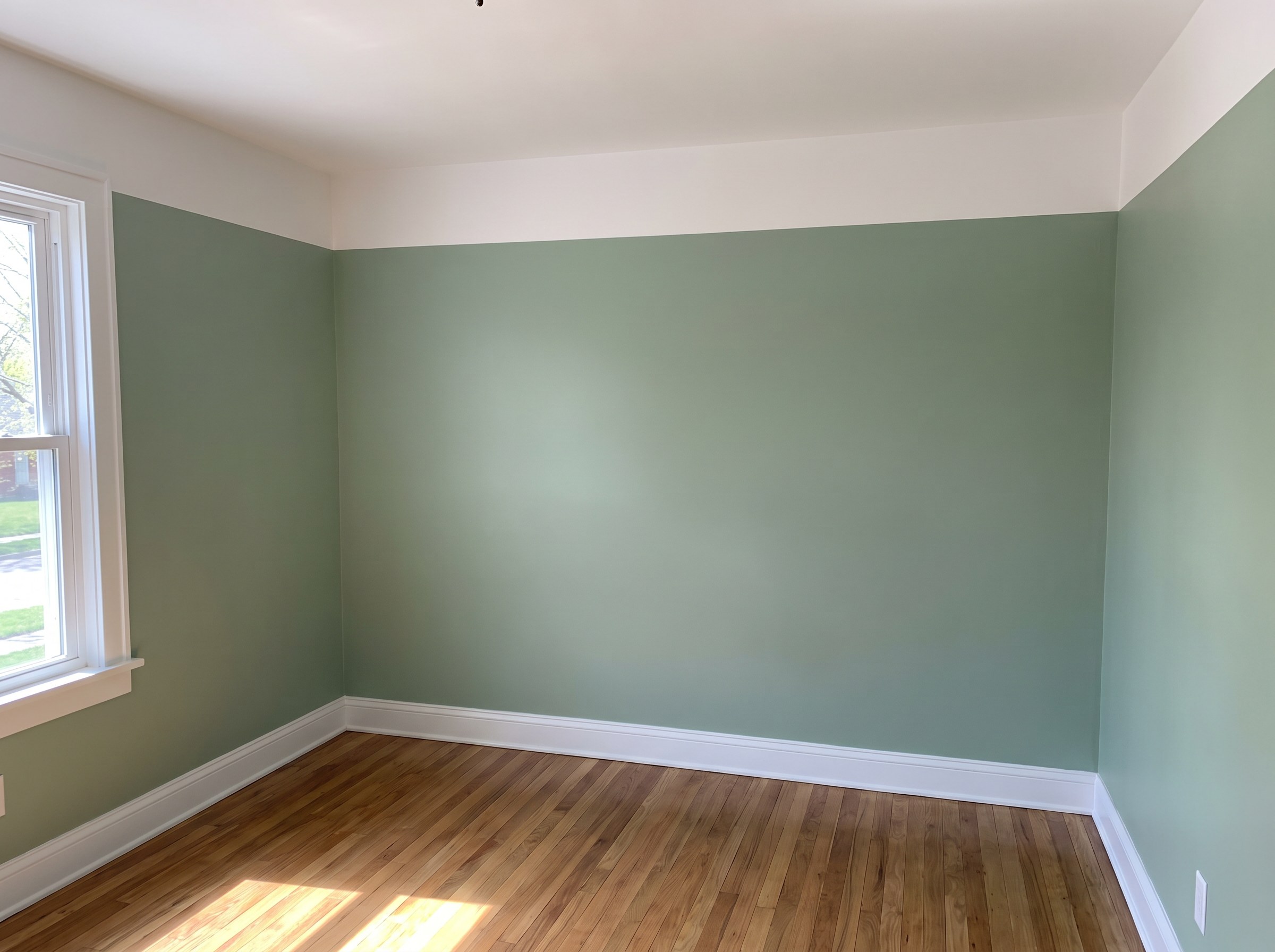 Interior room with freshly painted walls, ceiling and trim