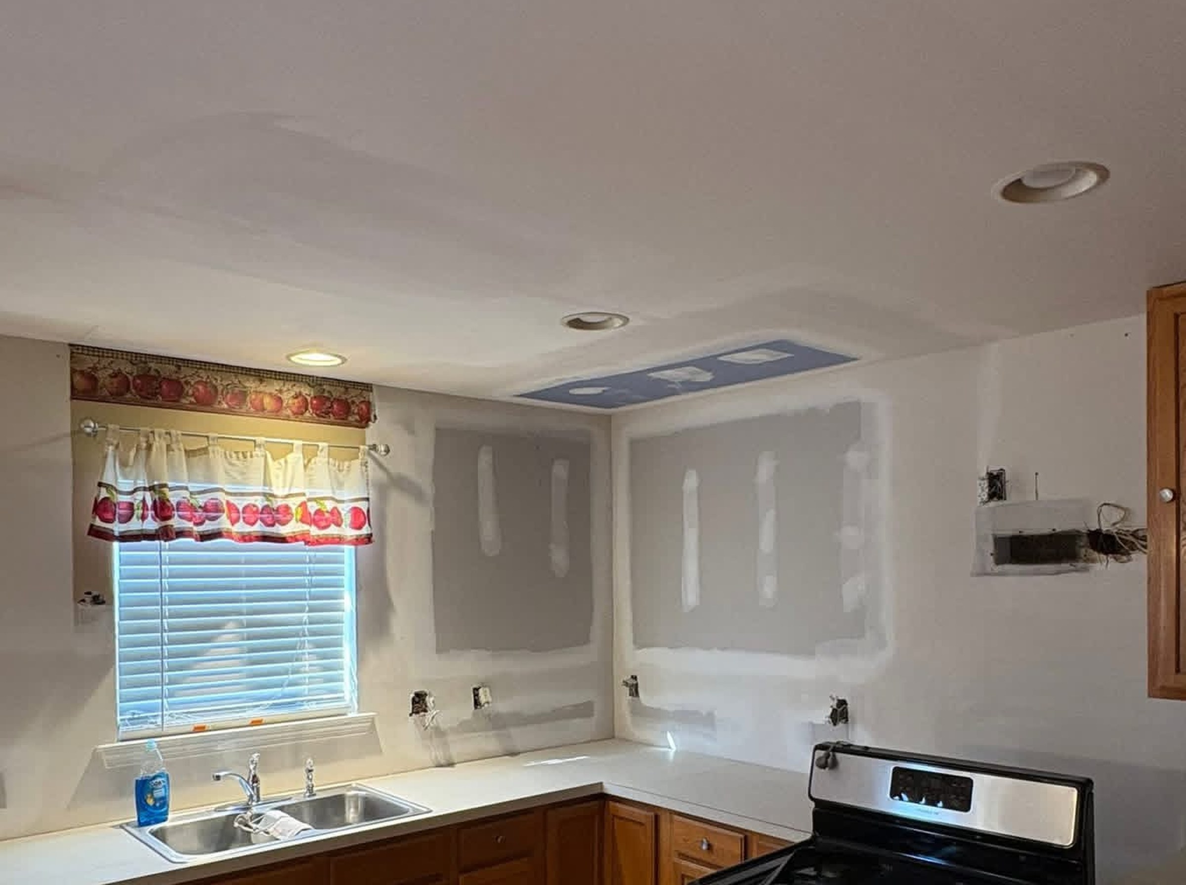 Kitchen wall skim coated and repaired before repainting