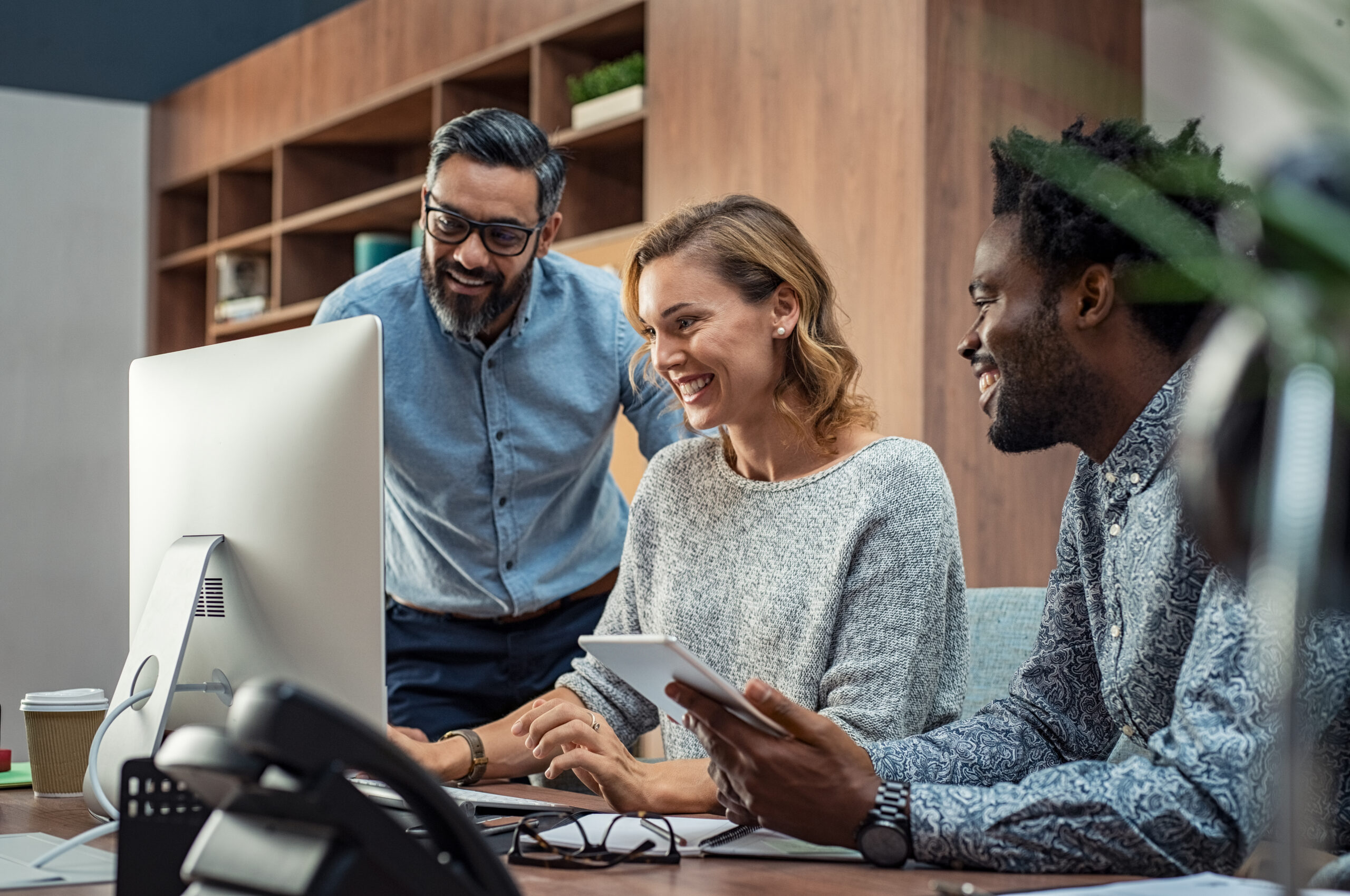 A small team working together at a computer