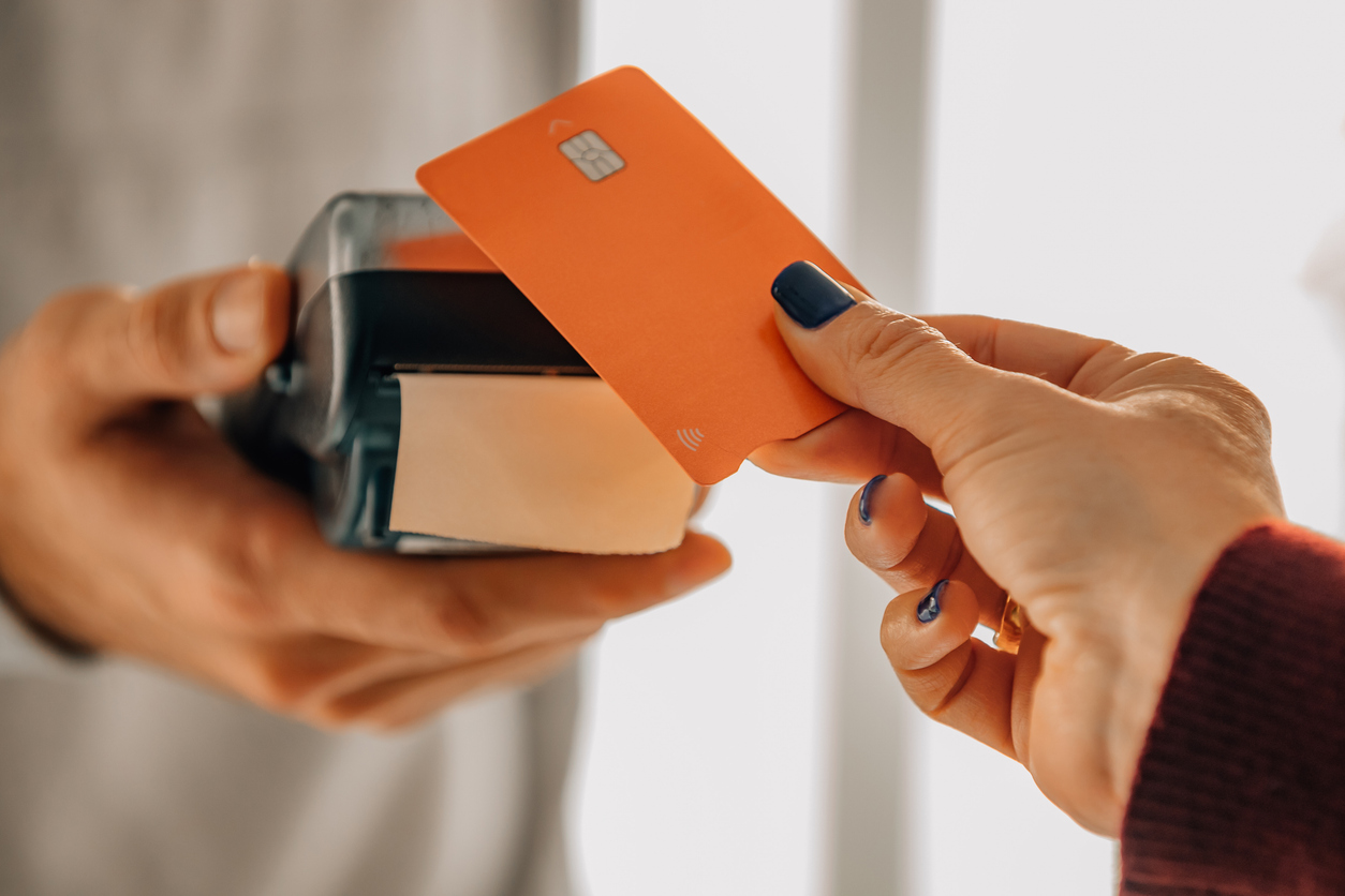 A card being swiped at a payment terminal
