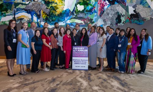 Attendees with the Ruby Jubilee sign at CelebrASIAN 2025