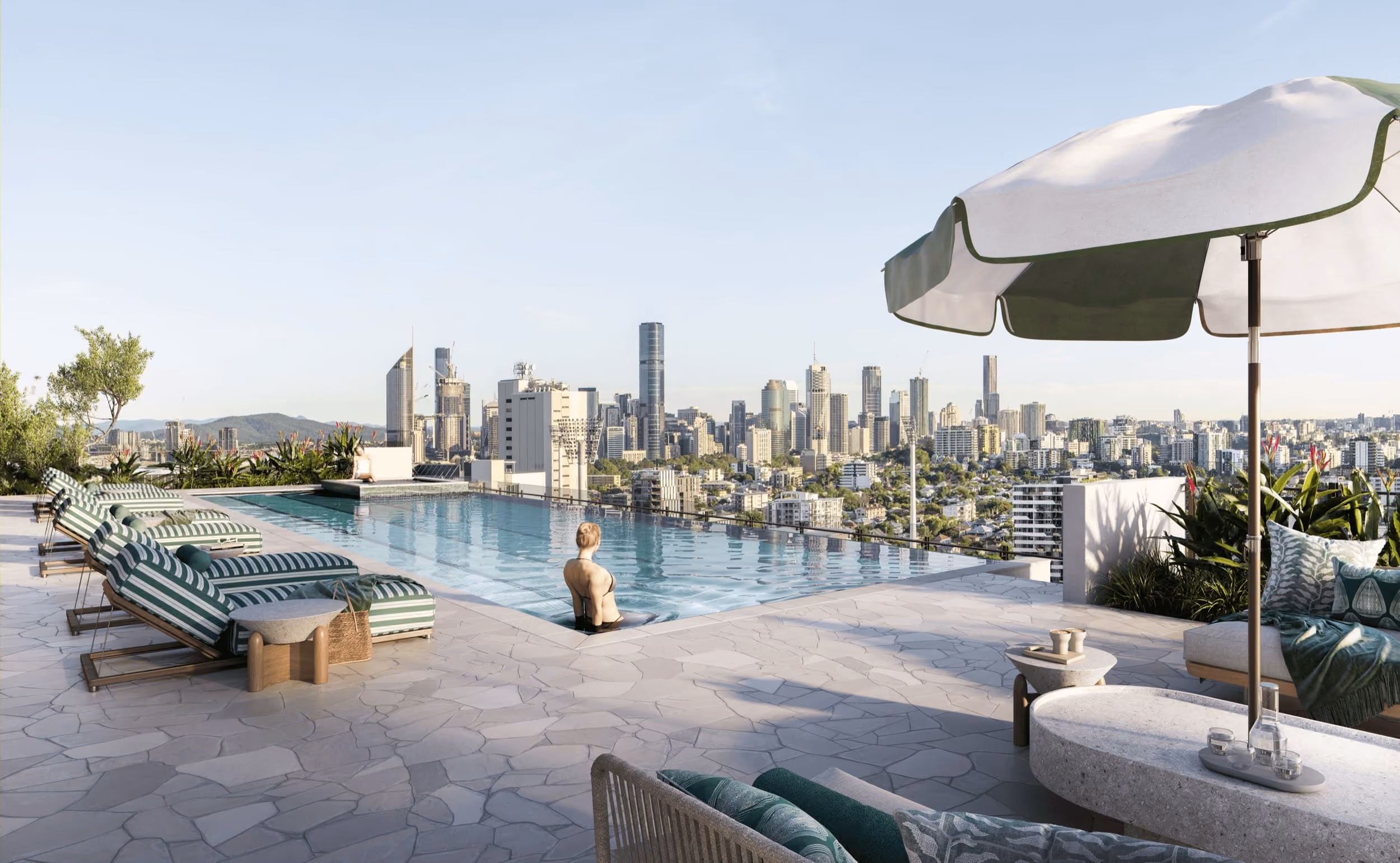 Concept render of a rooftop pool and terrace looking towards the Brisbane CBD skyline