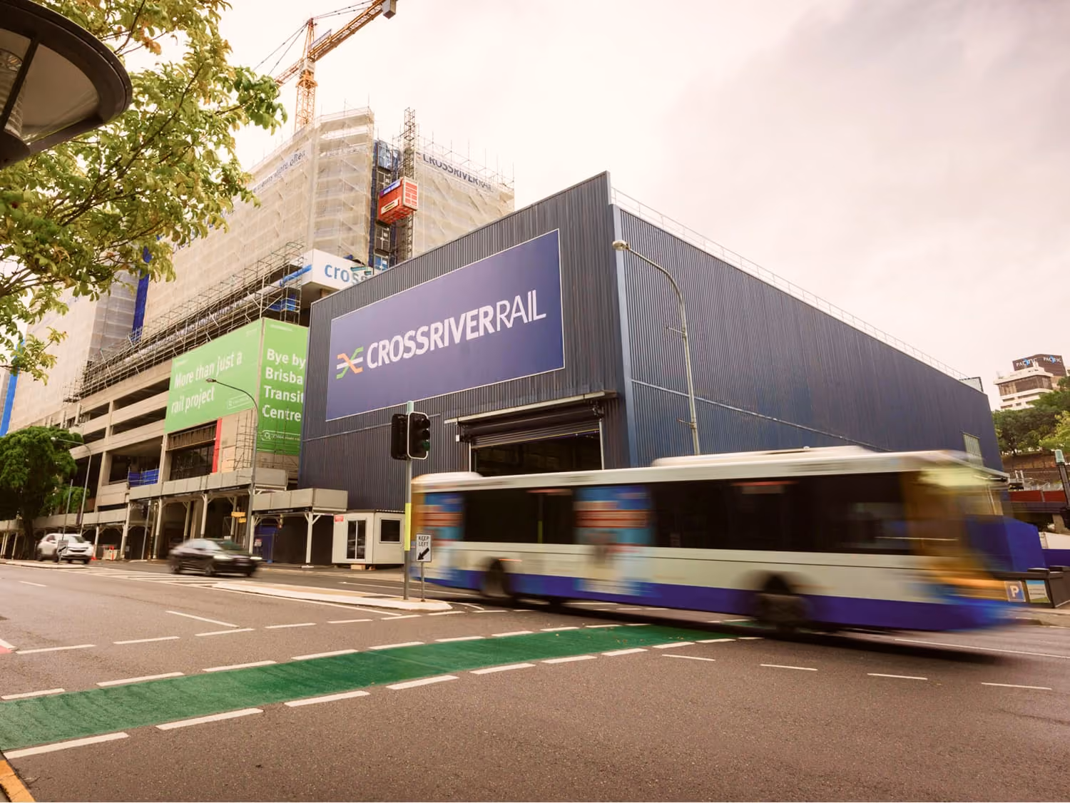 Cross River Rail construction site at Roma Street, Brisbane, with a bus passing