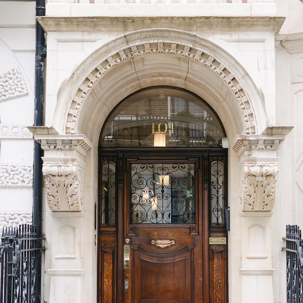 Stone entrance and arched doorway at 101 Harley Street