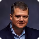 Portrait of Robert "Cujo" Teschner, VMax Group founder and author of Debrief to Win