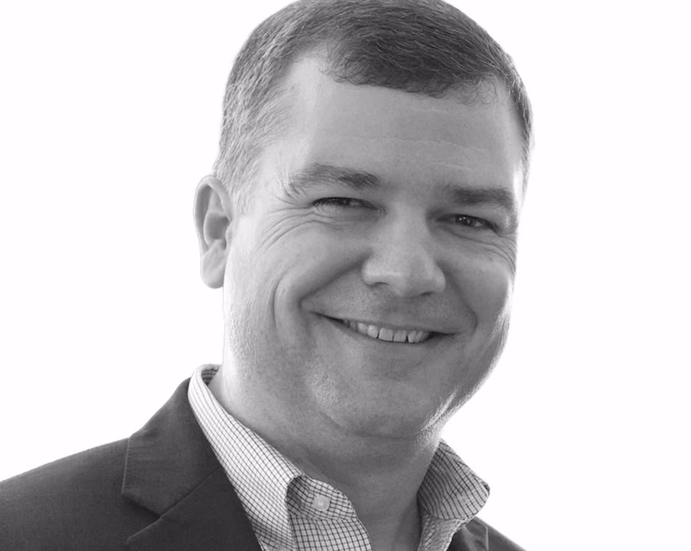 Black and white portrait of Robert "Cujo" Teschner, Founder and CEO of VMax Group