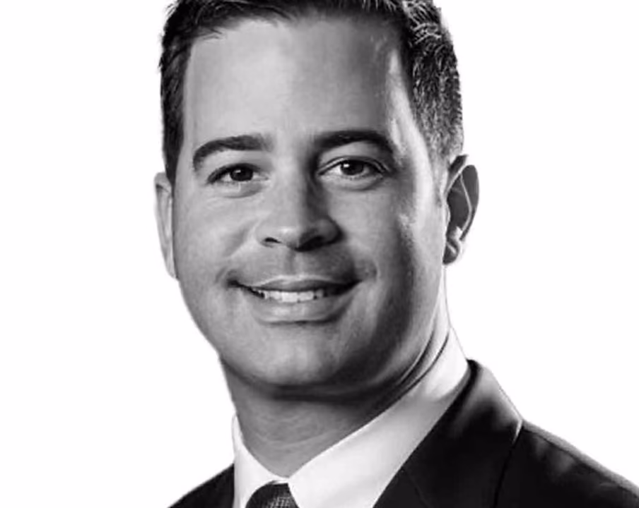 Black and white portrait of Taylor 'Dozer' Ferrell, Top Gun Teamwork coach and workshop leader at VMax Group