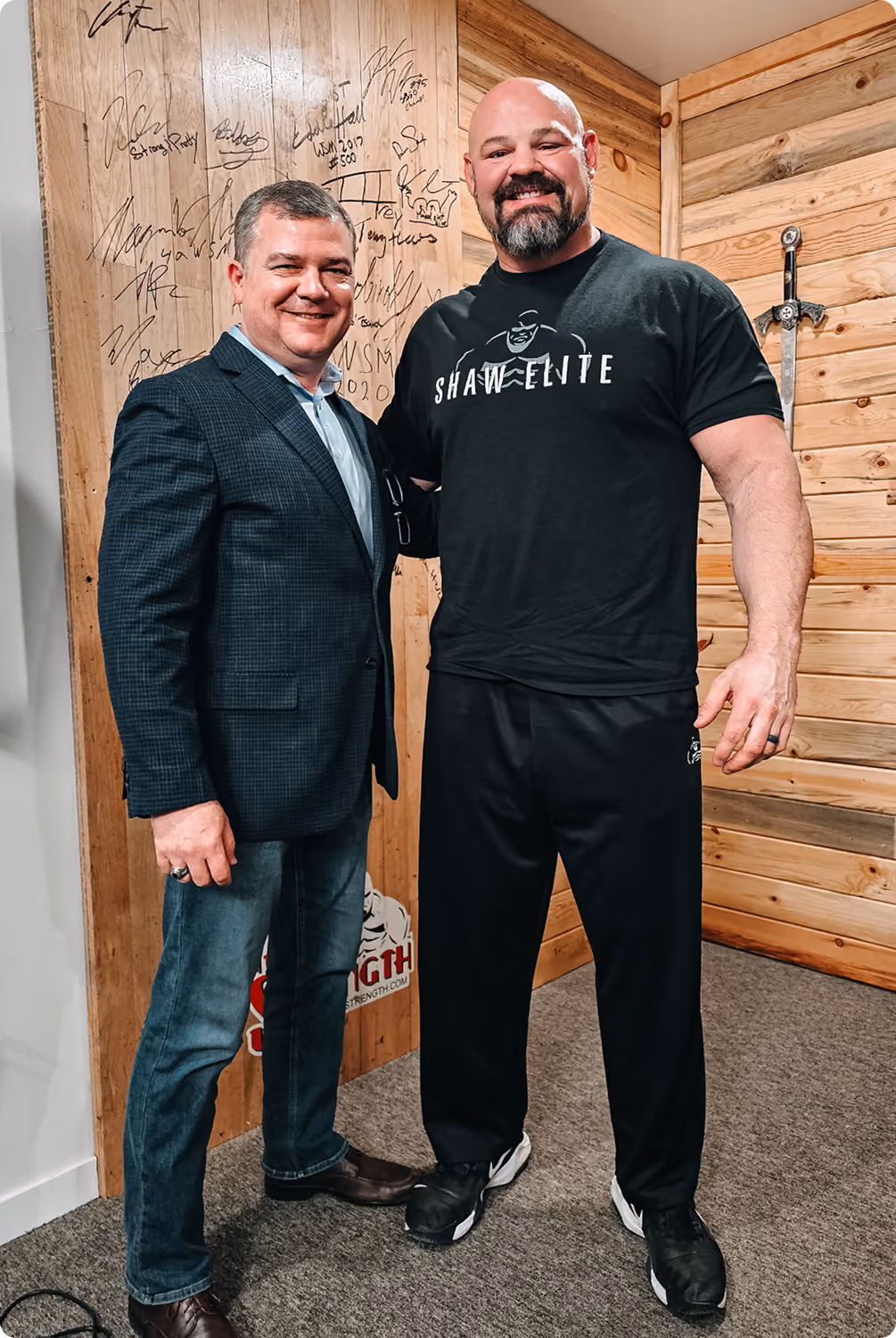 Robert "Cujo" Teschner standing with former World's Strongest Man Brian Shaw