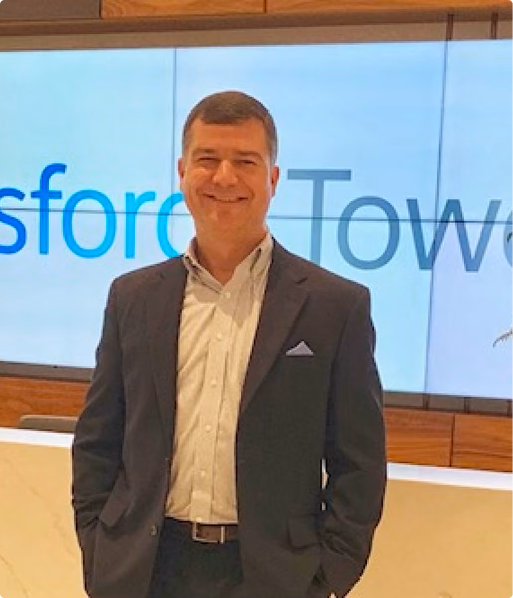 Robert "Cujo" Teschner, VMax Group founder, in front of a conference stage backdrop before a leadership keynote