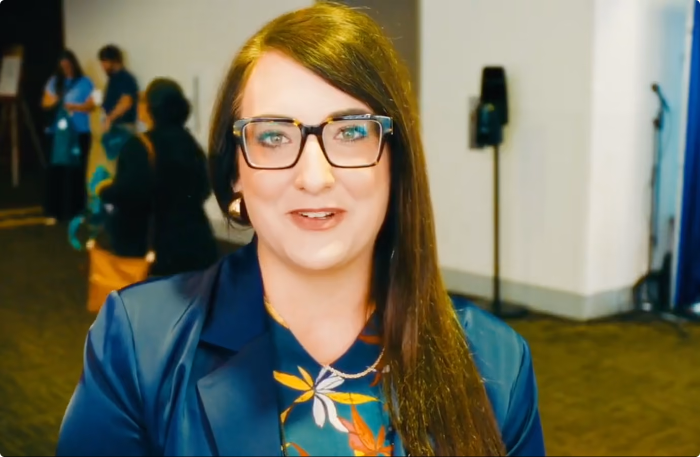 Theresa Waymire, AME St. Louis conference attendee, speaking on camera about a VMax Group keynote