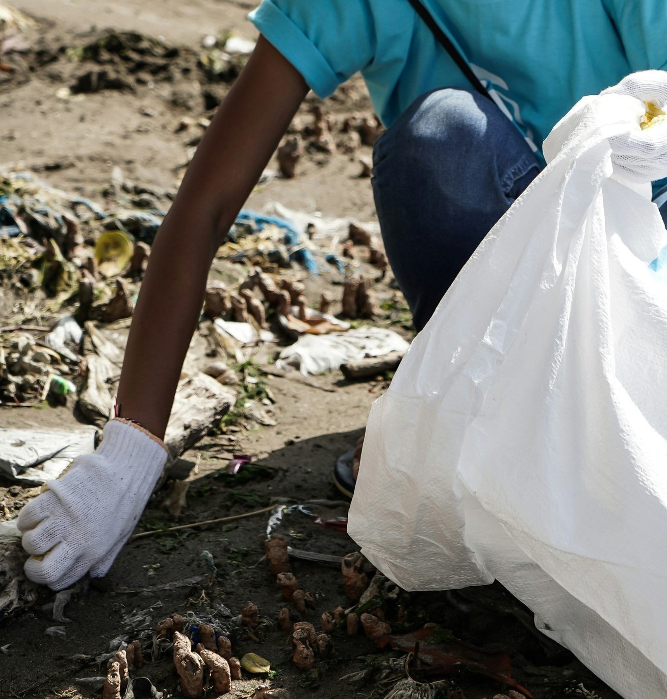 Volunteer litter-picking with a refuse sack
