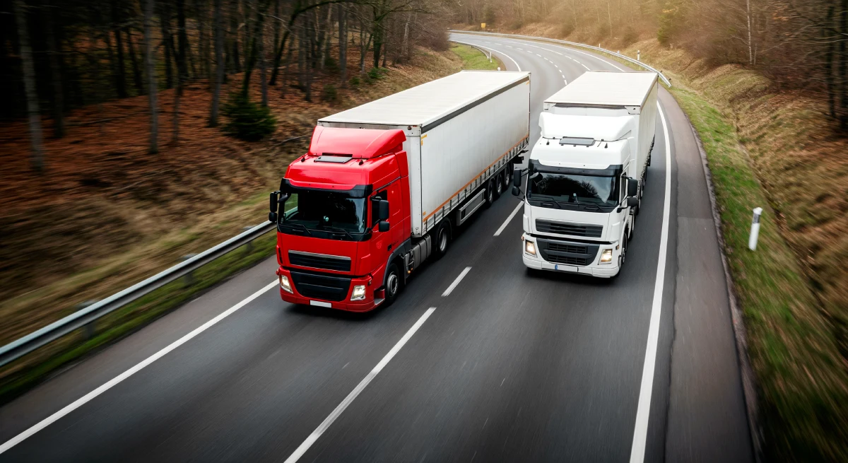 Fleet of freight trucks on highway