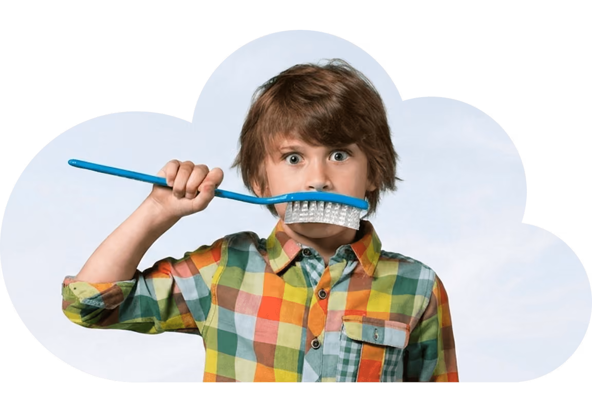 young boy brushing his teeth