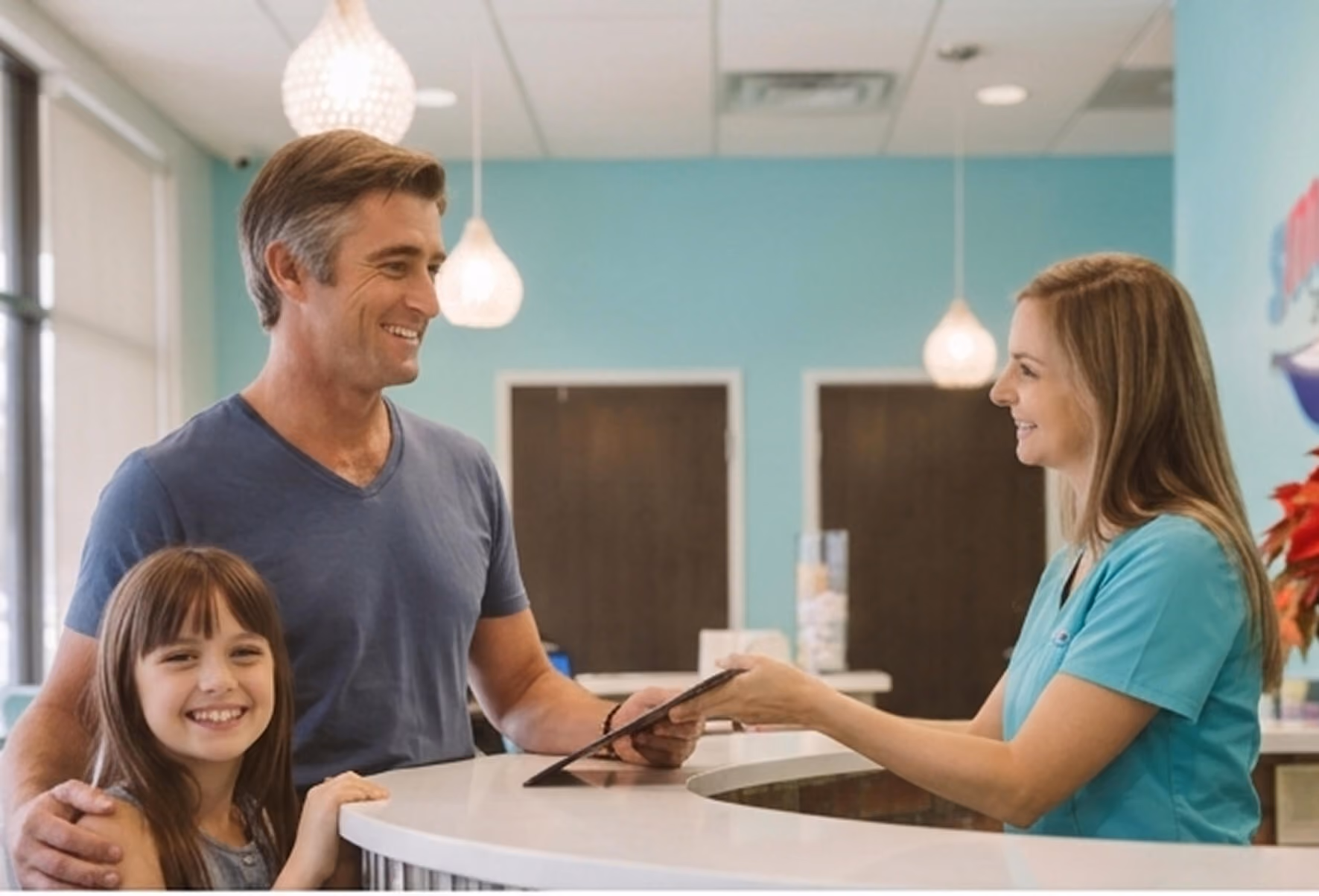 dad standing at the reception desk with his daughter talking to the receptionist