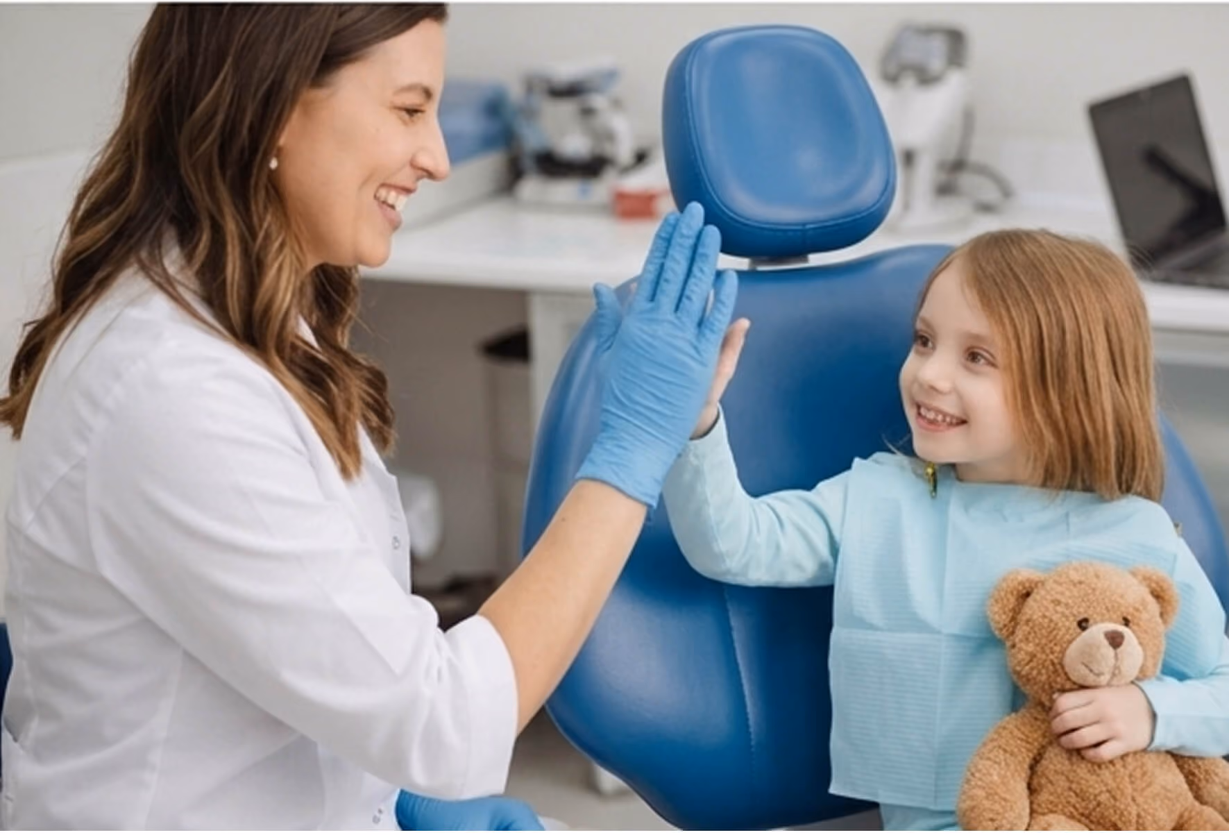 doctor hi 5 with the little patient
