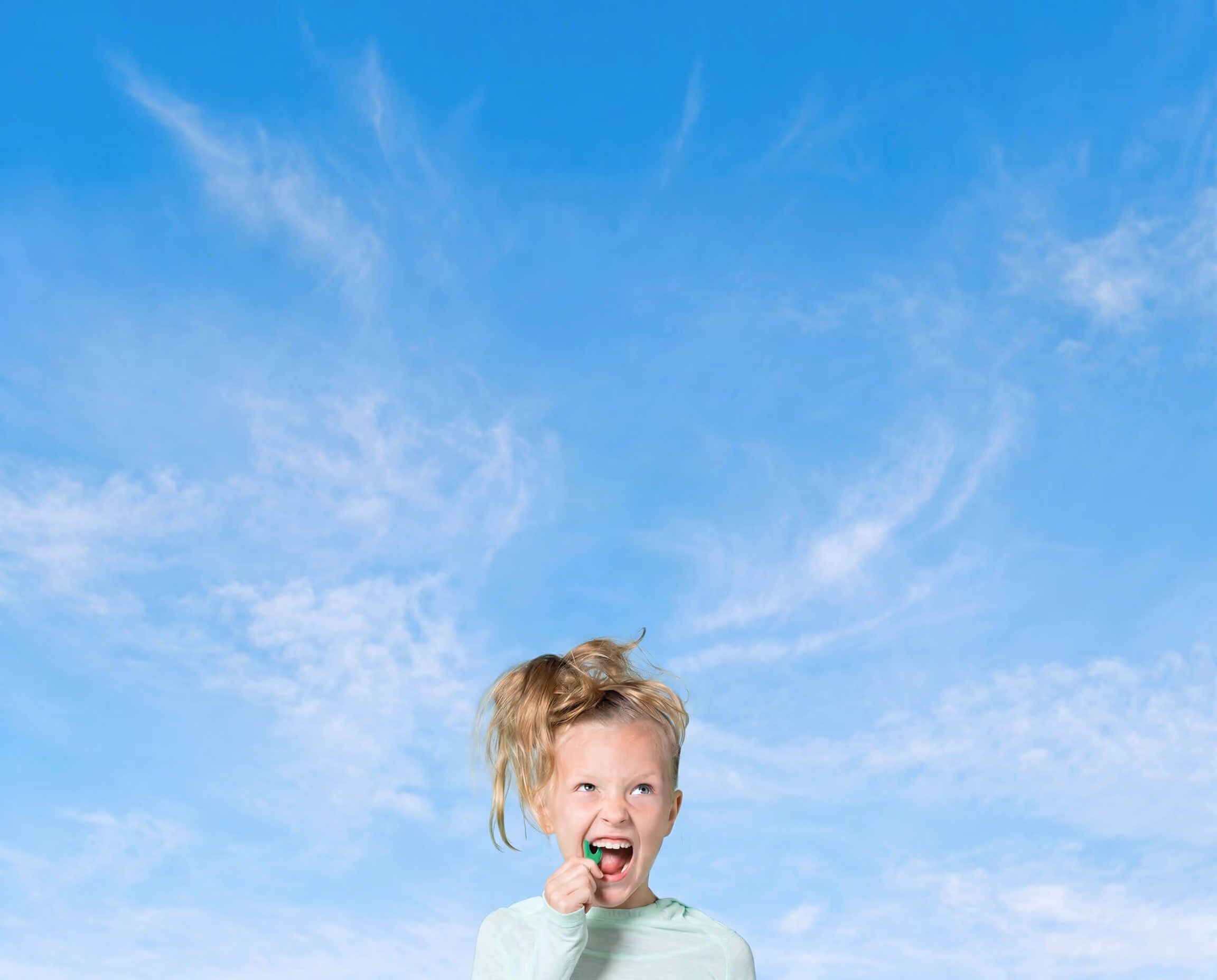 girl flossing her teeth