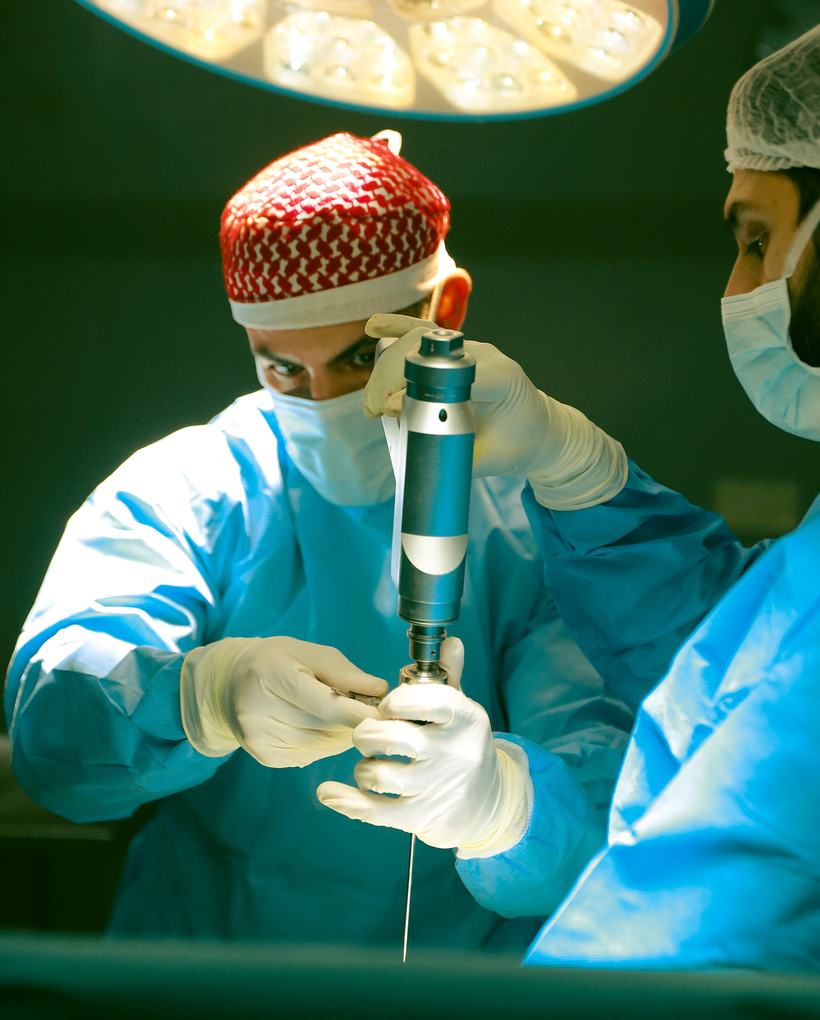 A FAJR surgeon operating with a specialist instrument during a mission.