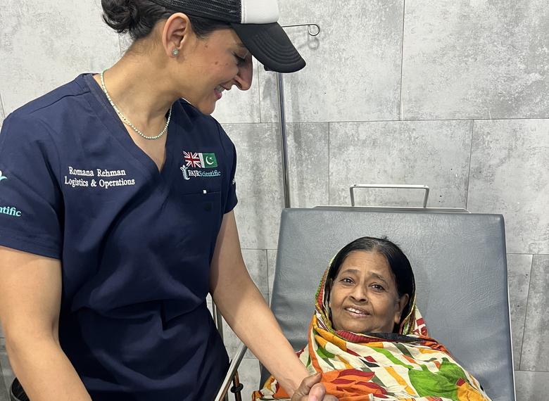 A FAJR doctor with an elderly patient during a surgical mission.