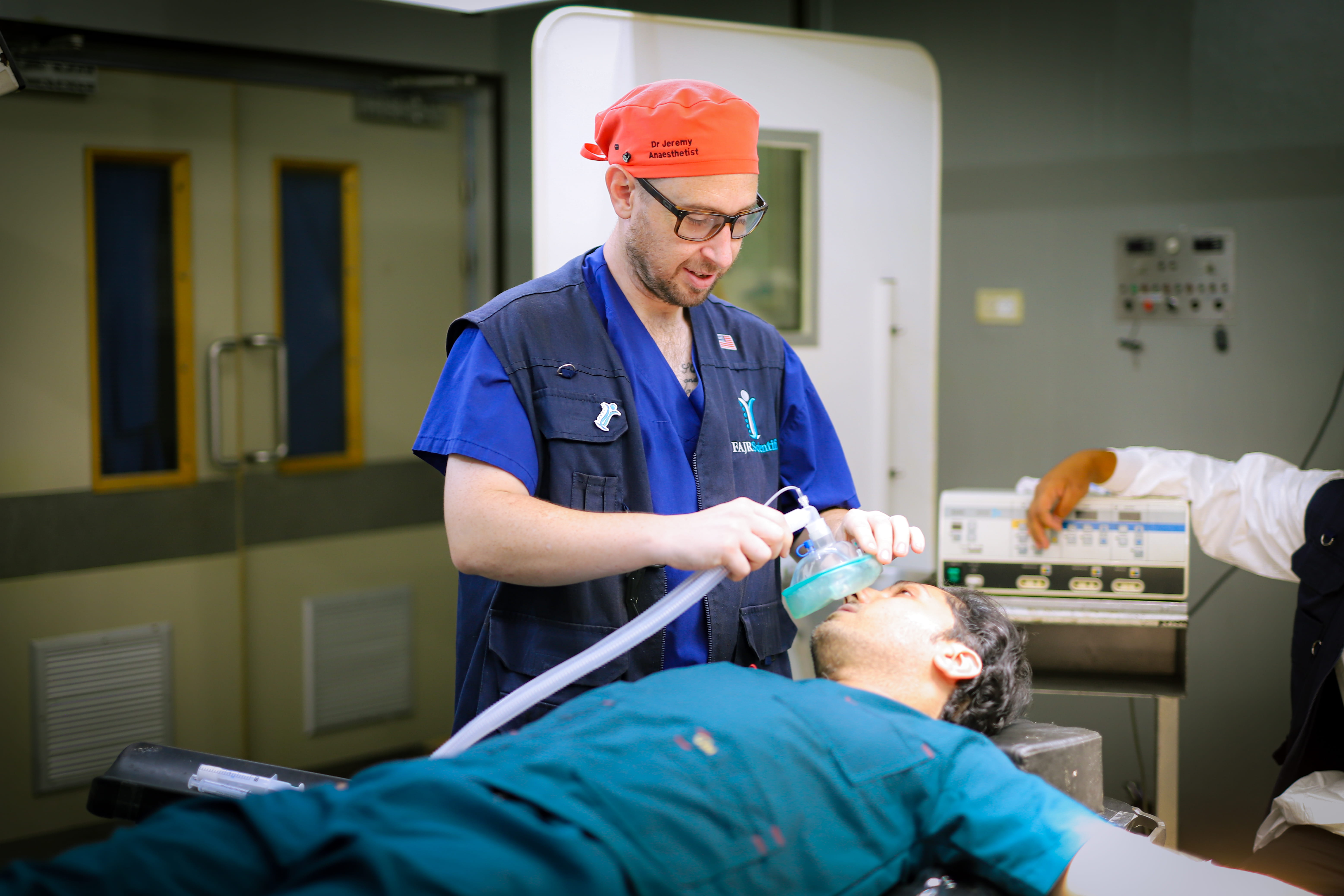 Volunteer surgical team operating