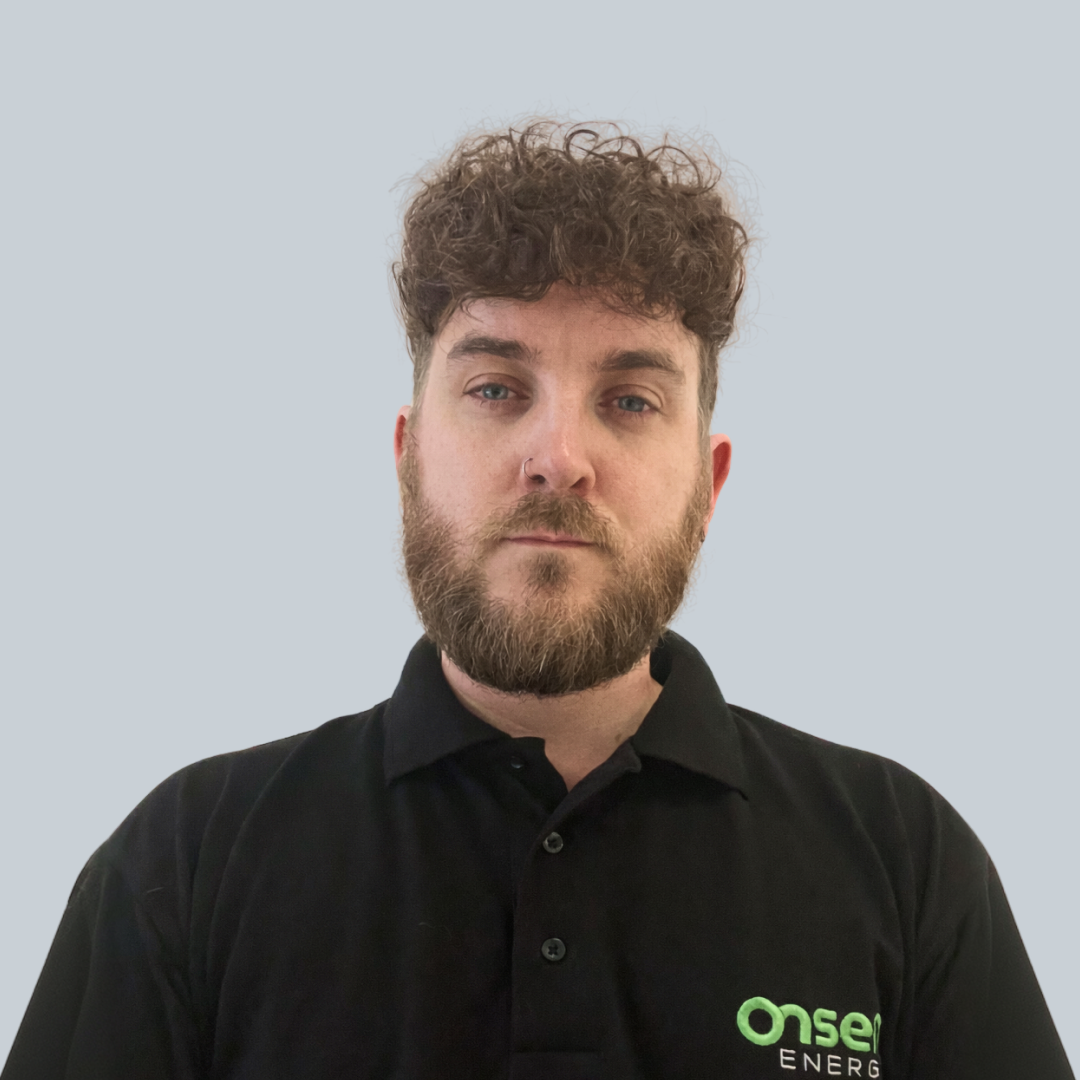 Eliott, Onsen Energy team member, in a black polo with the Onsen Energy logo.