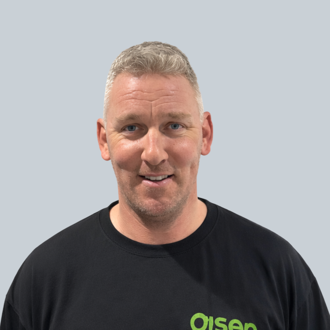 Mike, Onsen Energy team member, in a black branded t-shirt.