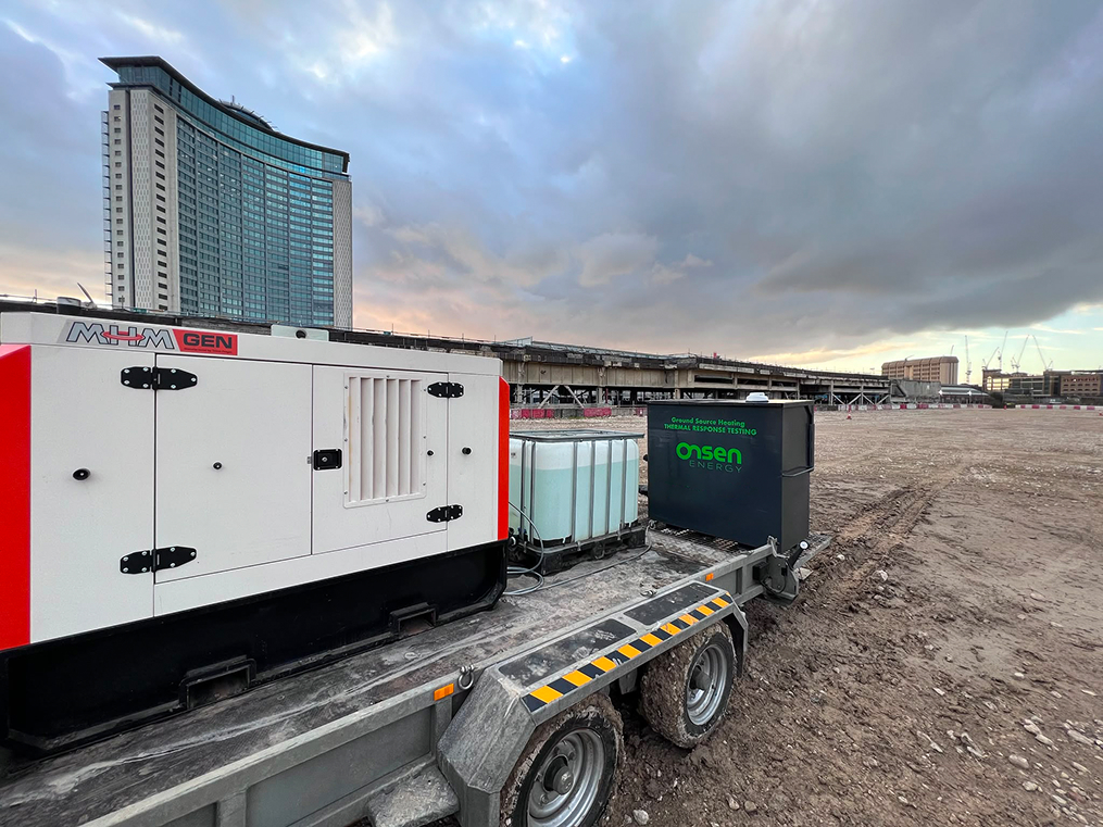 Onsen Energy testing unit and generator on a trailer at an urban construction site.
