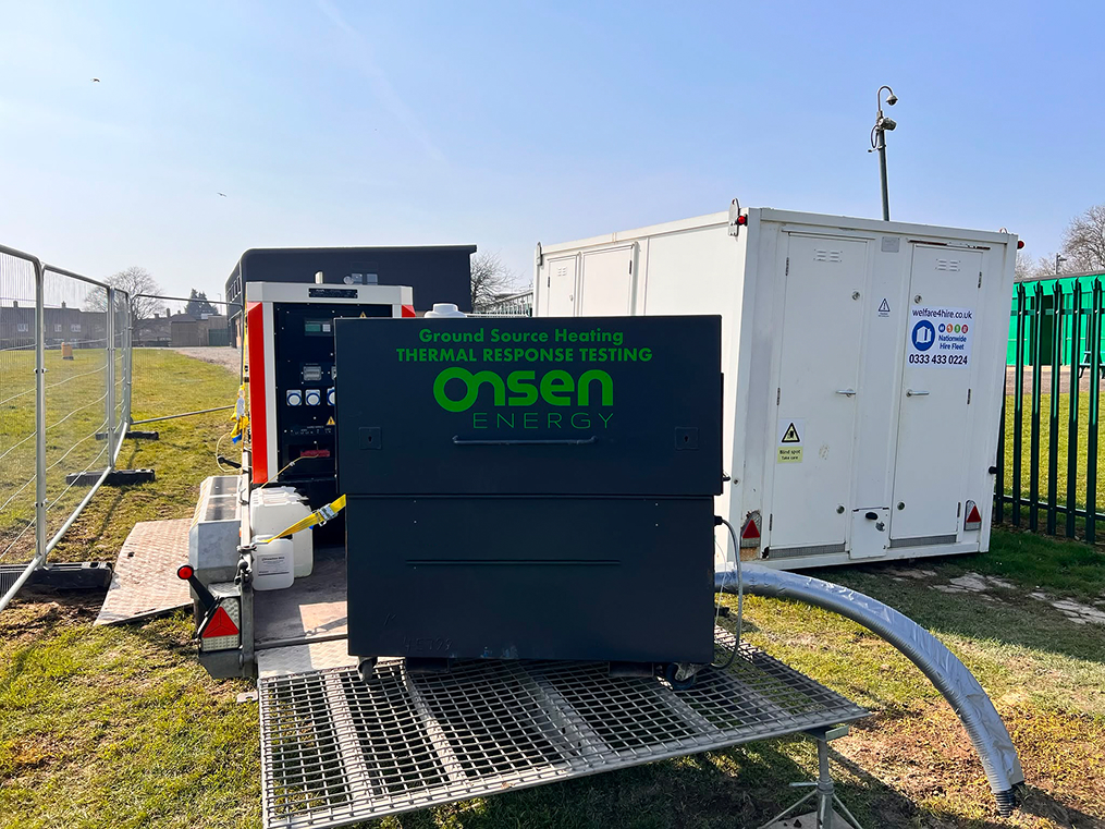 Onsen Energy thermal response testing cabinet on grass beside a generator and water tank.