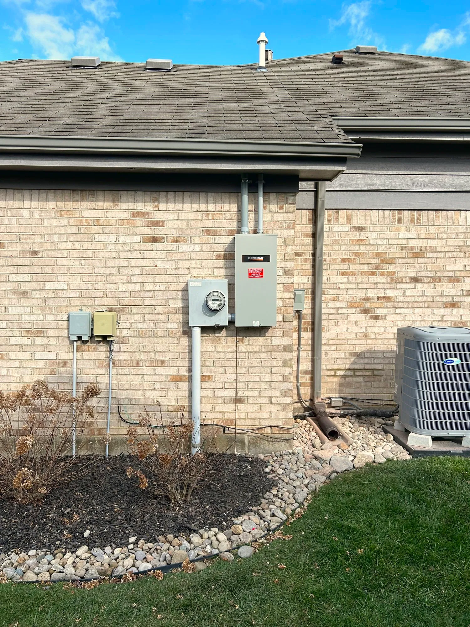 Automatic transfer switch installed next to the utility power meter