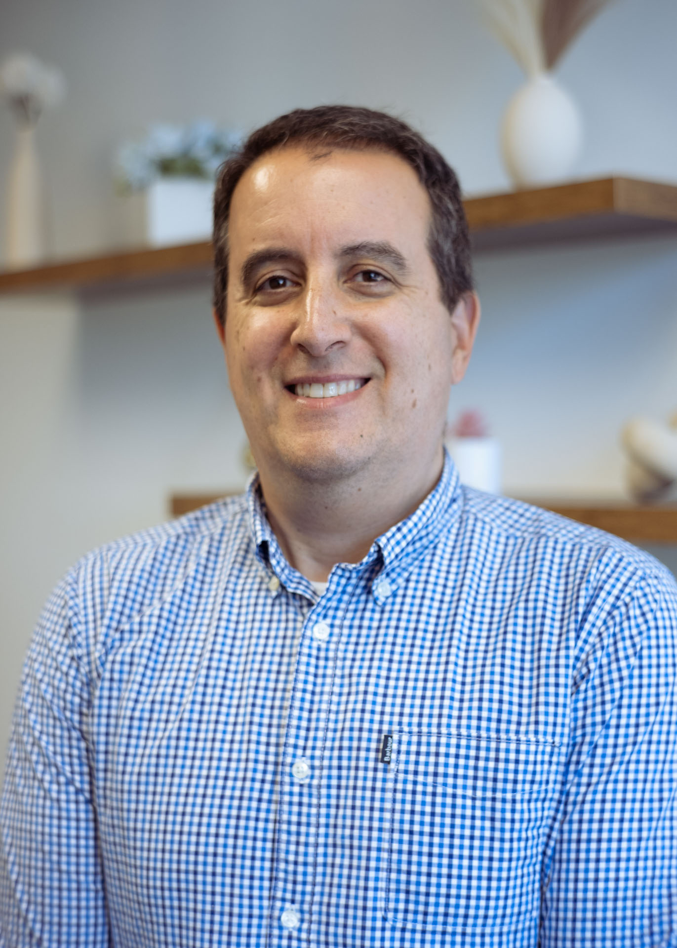 A portrait of a man smiling.