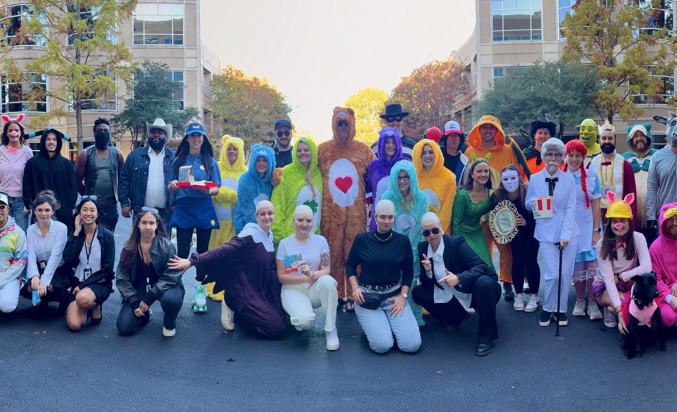The RSM& team in costume outside the office