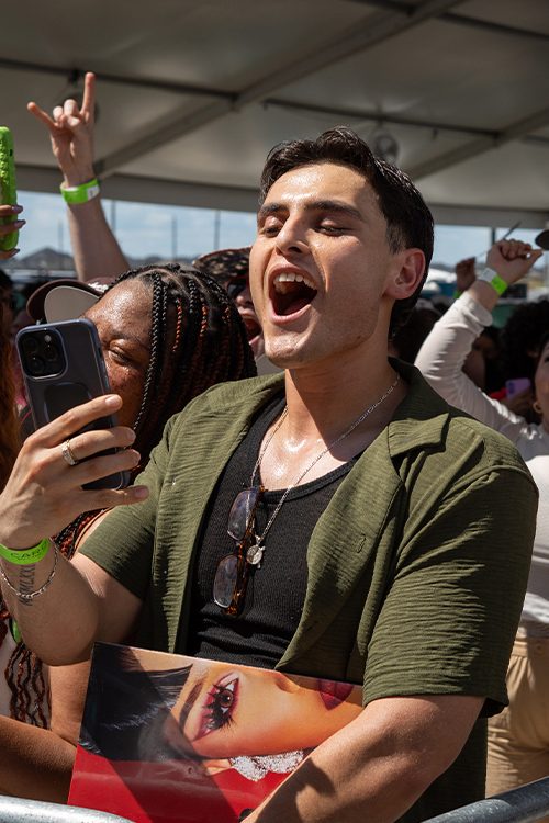 Crowd reacting at a live RSM and brand experience