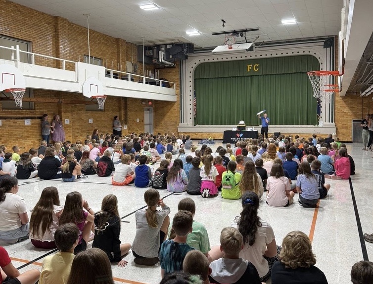 Elementary school students celebrating a successful chocolate fundraiser