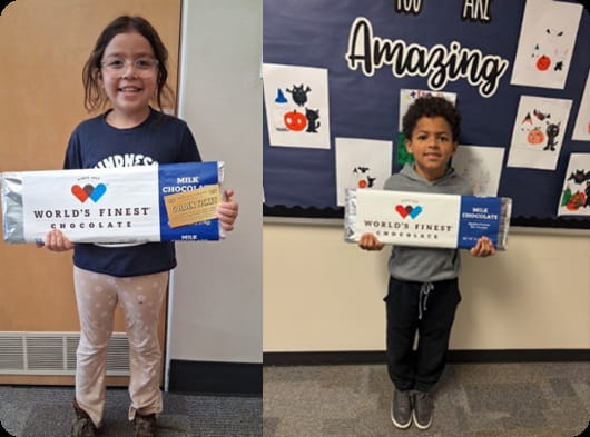 Students hold World's Finest Chocolate bars.