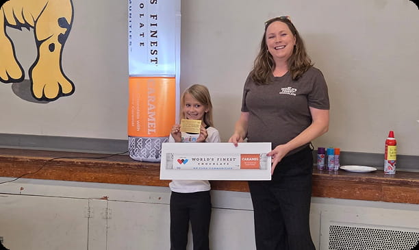 LEAP Elementary student and teacher celebrate their fundraising success.