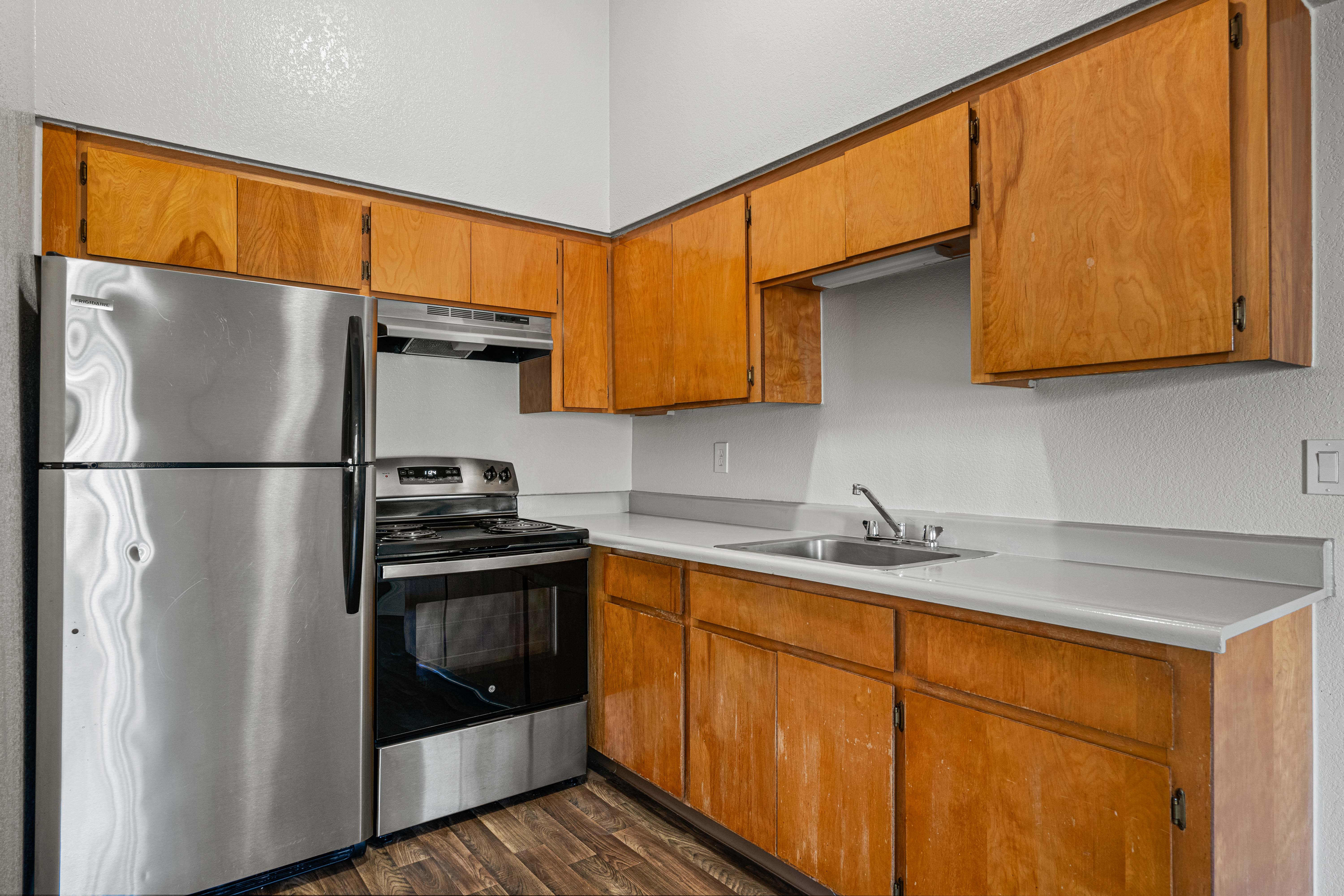 Kitchen with stainless steel appliances, corner view