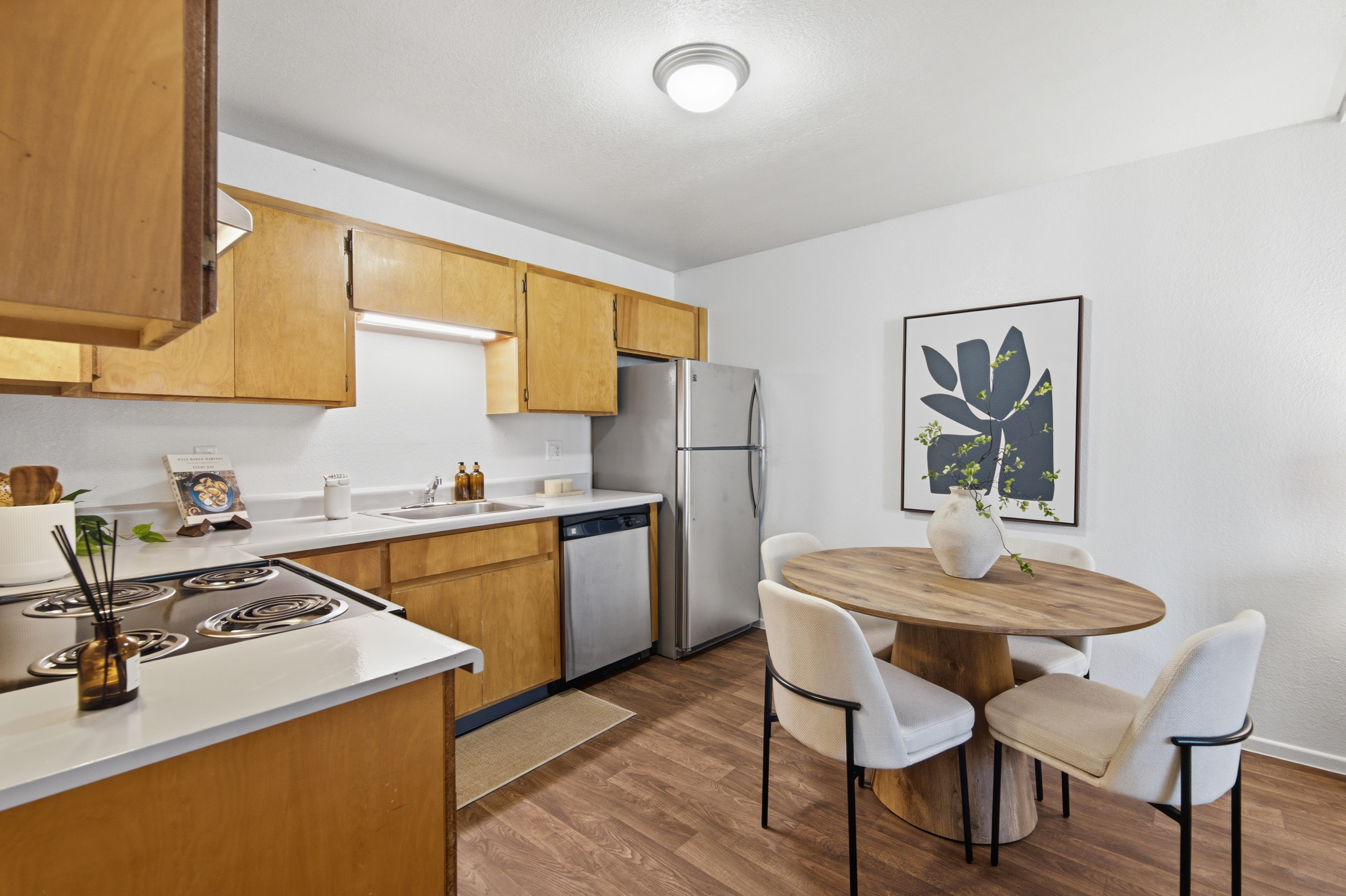 Furnished kitchen and dining room, corner view