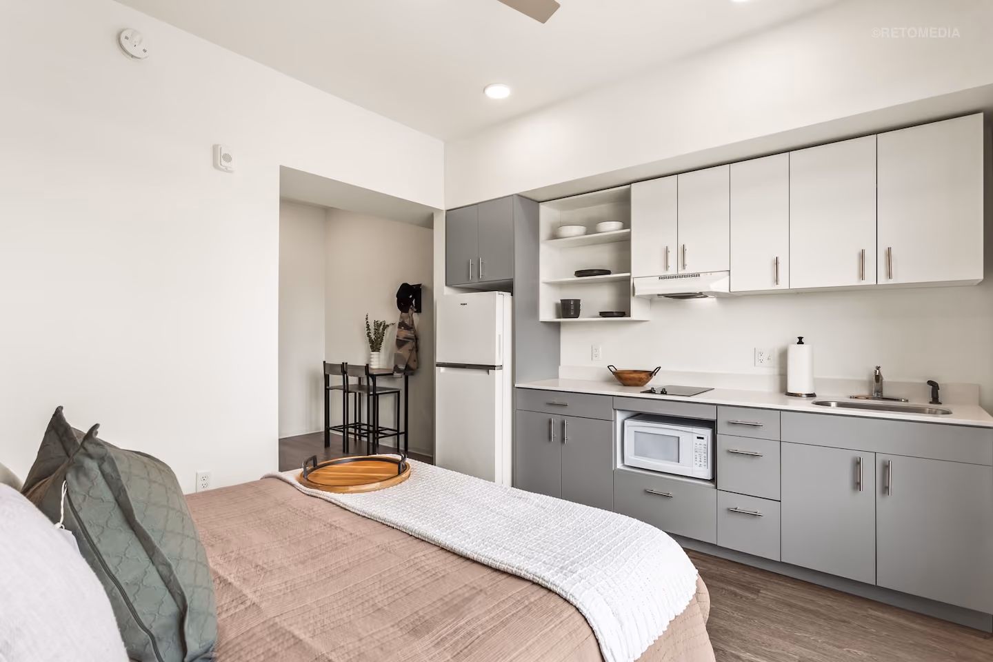 Studio with bed and kitchenette, large window at Koz on State in Salem, Oregon